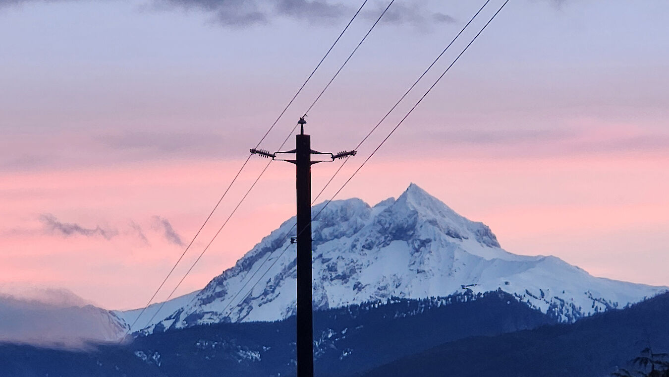 Powerline with mountain in background